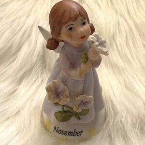 NOVEMBER ANGEL VINTAGE FIGURINE WITH FLOWER SCULPTURE RARE